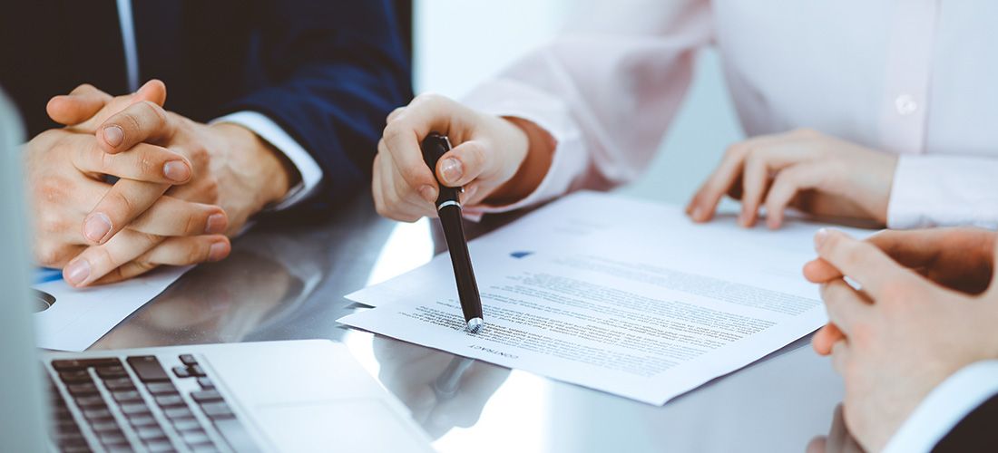 three people reviewing joint tenancy documents