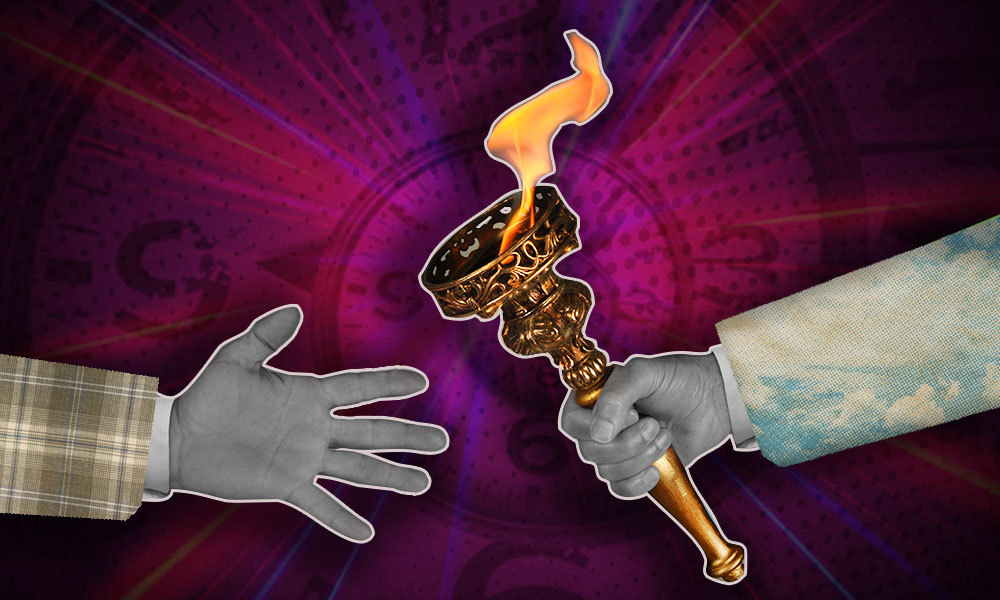 one hand passing a torch to another hand