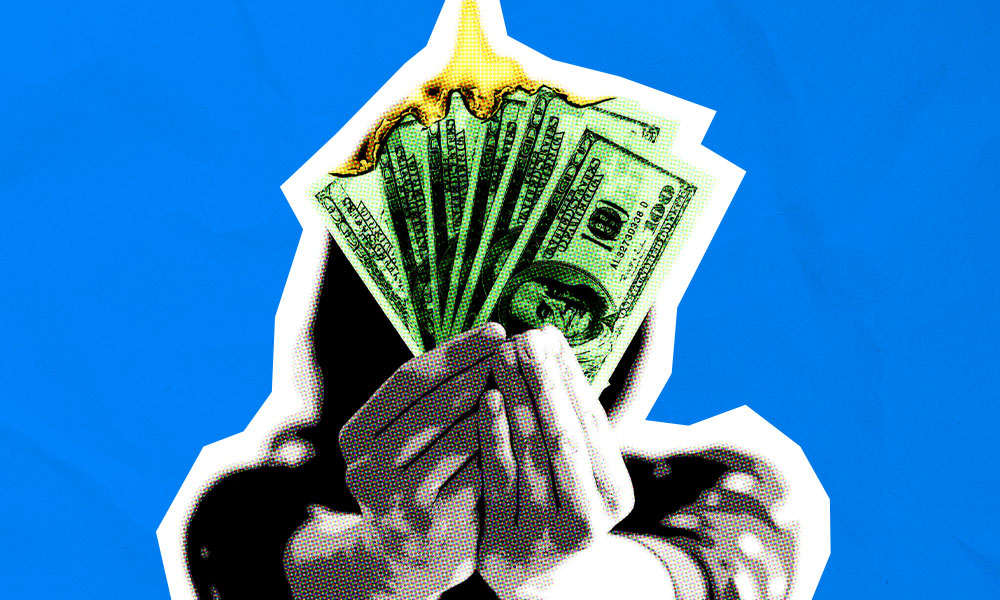 Illustration of a person holding a fanned-out stack of dollar bills, with vivid green coloring, in front of a bright blue background. The bills appear to be burning at the top, with flames erupting and blending into the blue background, symbolizing spendthrift behavior and money loss.