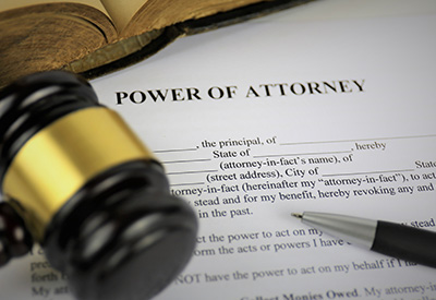 A close-up of a 'Power of Attorney' document