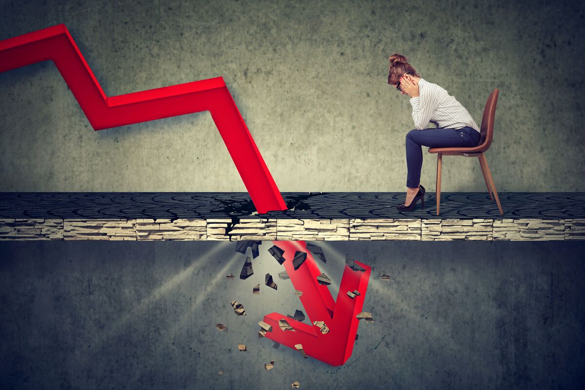 a woman looking at downward arrow concerned about her beneficiaries and their inheritance 
