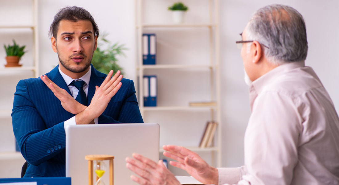 A beneficiary disclaiming an inheritance by crossing his arms in front of the executor of the estate.