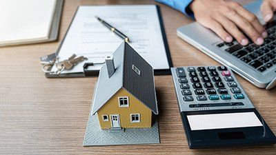 Photo of a model house on a desk