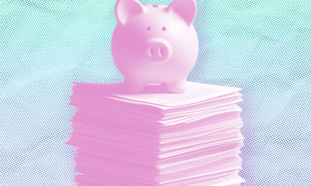 A pink piggy bank sits atop a stack of pink documents against a blue-dotted background