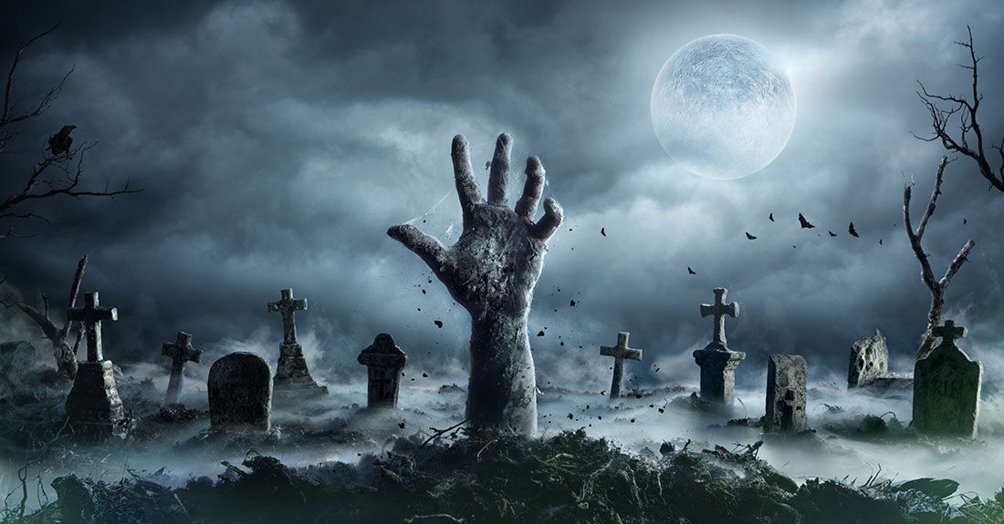 a zombie hand coming out of a grave