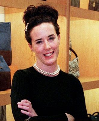 Kate Spade smiling and crossing her arms posing for a picture