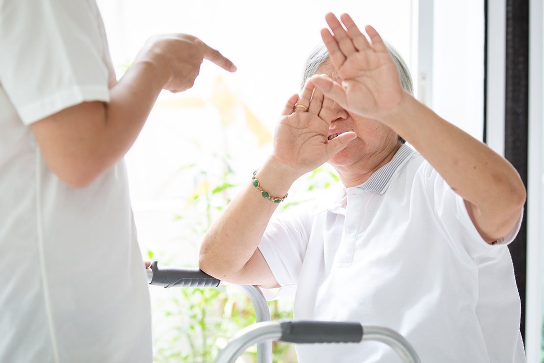 Guardianship - Senior woman putting her hands up in defense