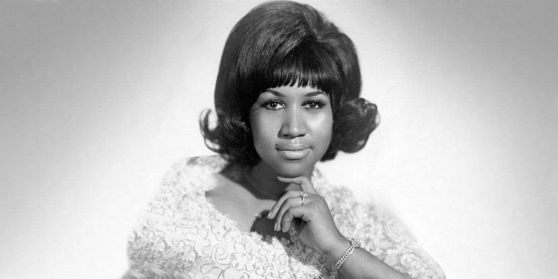 Aretha Franklin posing for a picture