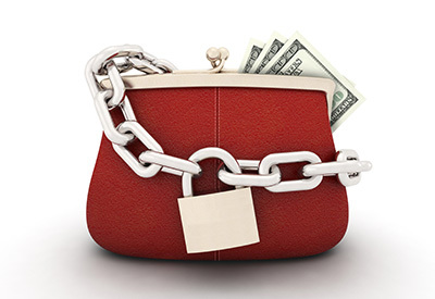 a coin purse with money sticking out and wrapped with a chain and lock