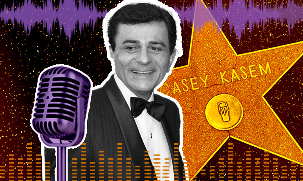 Casey Kasem with a microphone and a Hollywood gold star behind him