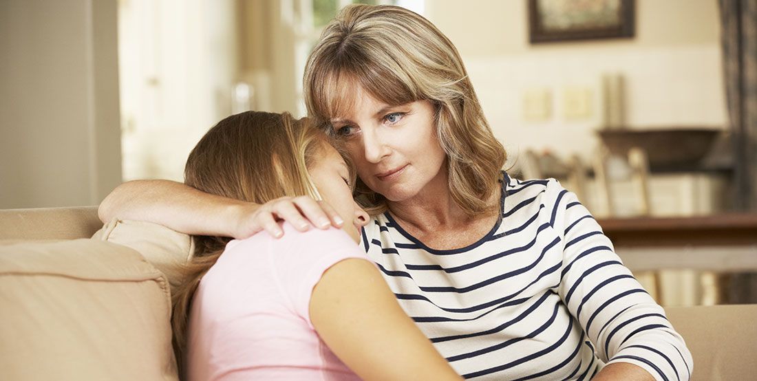 an adult consoling a child