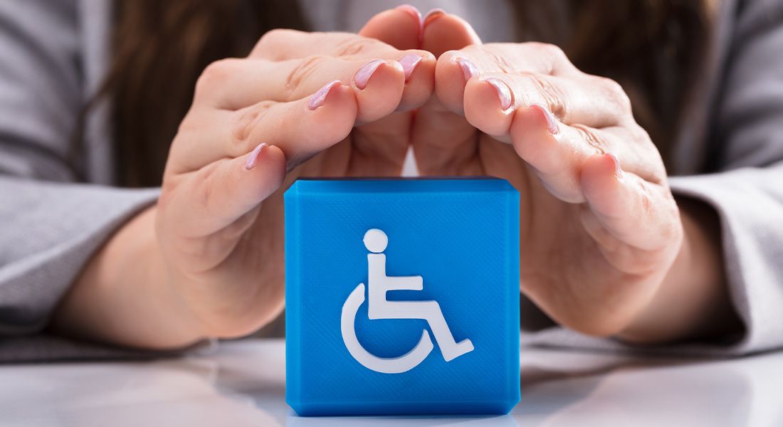 Hands over a handicapped block