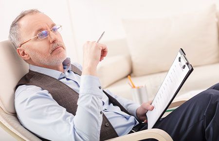 a professional successor trustee listening and writing notes