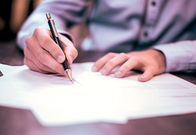 someone signing a trust document