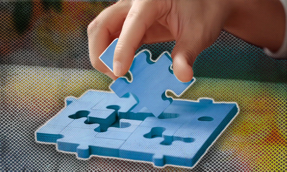 A hand carefully placing the final piece of a puzzle, symbolizing the intricate and thoughtful process of trust administration coming together to fulfill the grantor's wishes.