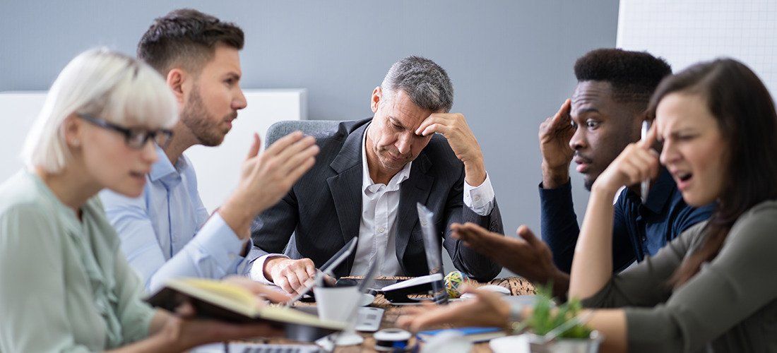 a group of people stressed over uncooperative trustees 