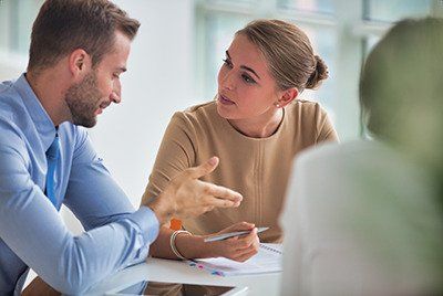 an attorney going over paperwork with client
