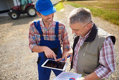 two farmers going over their estate plan for the farm