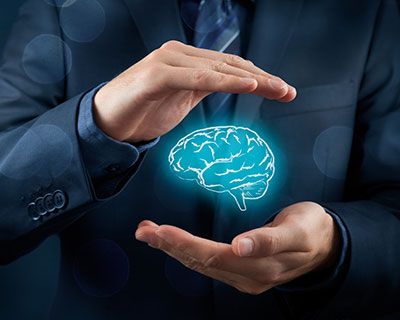 a man holding an animation of a brain