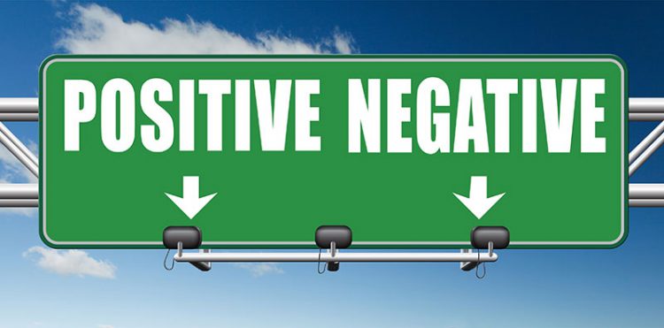 a highway sign that says positive negative