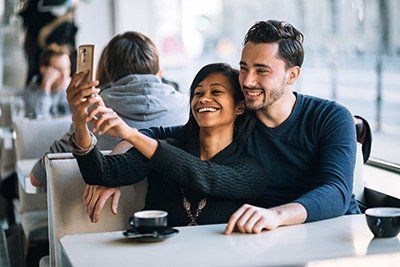 Young couple taking a picture of themselves