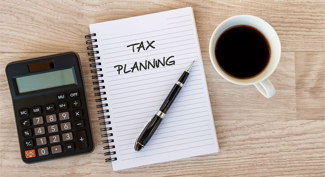 Estate Plan - Notebook with tax planning written across the page