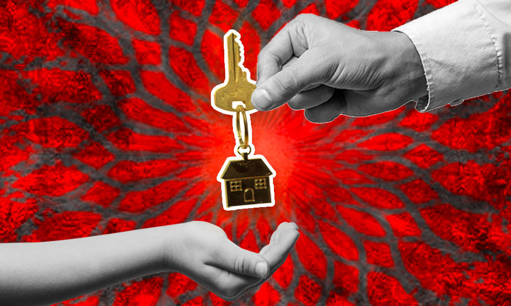 elder persons hand passing down inheritance to a younger hand