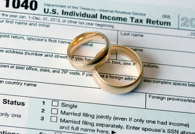 two wedding bands on top of a tax return document