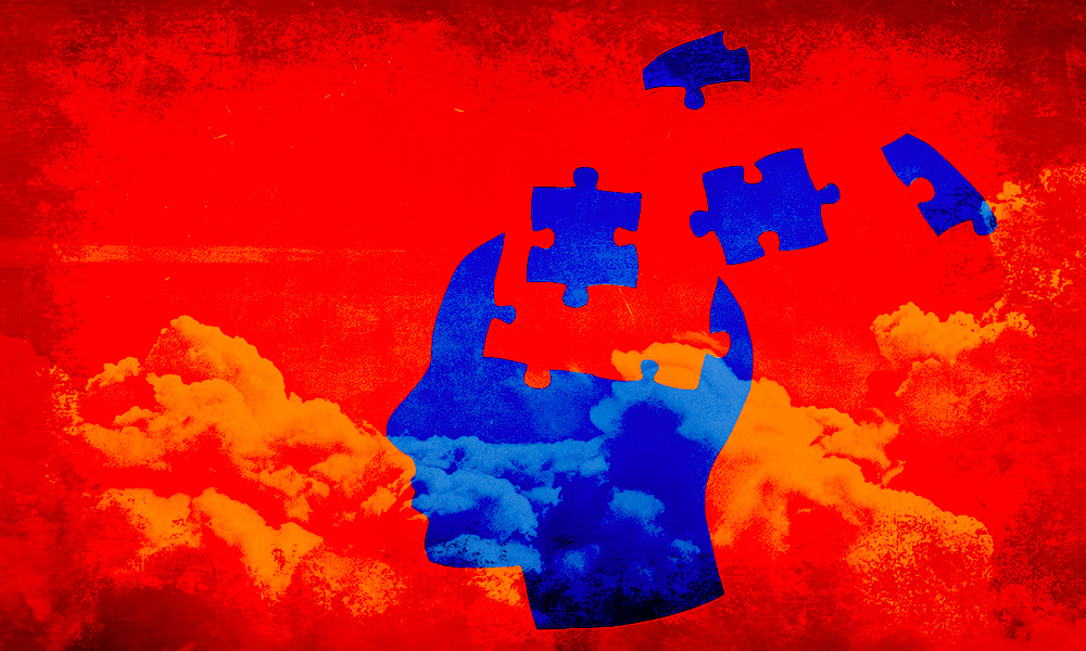 A silhouette of a human head against a red backdrop with clouds, where the head is composed of puzzle pieces in blue and some of which are disconnected