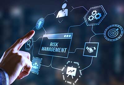 A person interacts with a digital interface displaying various aspects of risk management