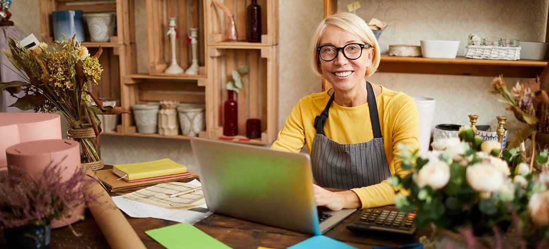 Buisness Succession - Senior woman at the desk of her small business