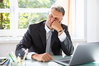 Estate Plan - Worried senior man working on a laptop