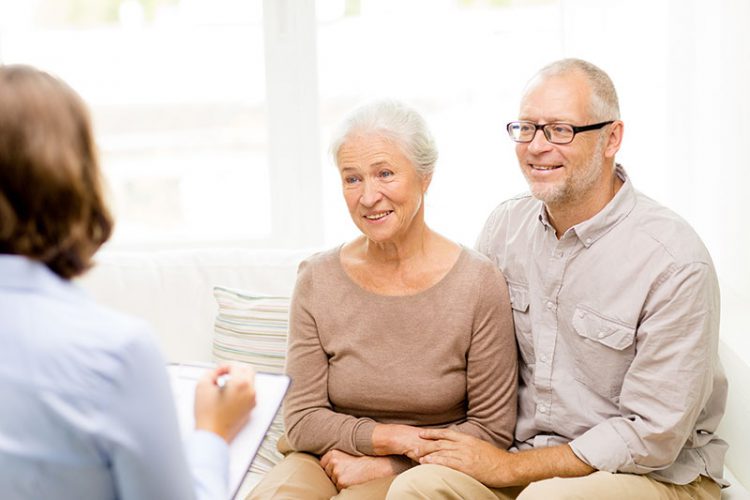 Estate Plan - Senior couple doing an in-home consultation for estate planning