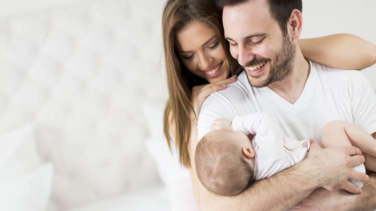 Estate Plan - New parents holding their baby