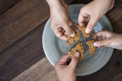 4 people sharing a cookie