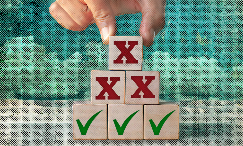 A hand selects a block with a red X from a stack, symbolizing common mistakes in estate planning when trying to avoid probate.