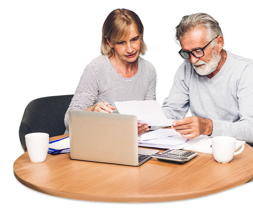married couple at a desk going over advantages of estate tax planning