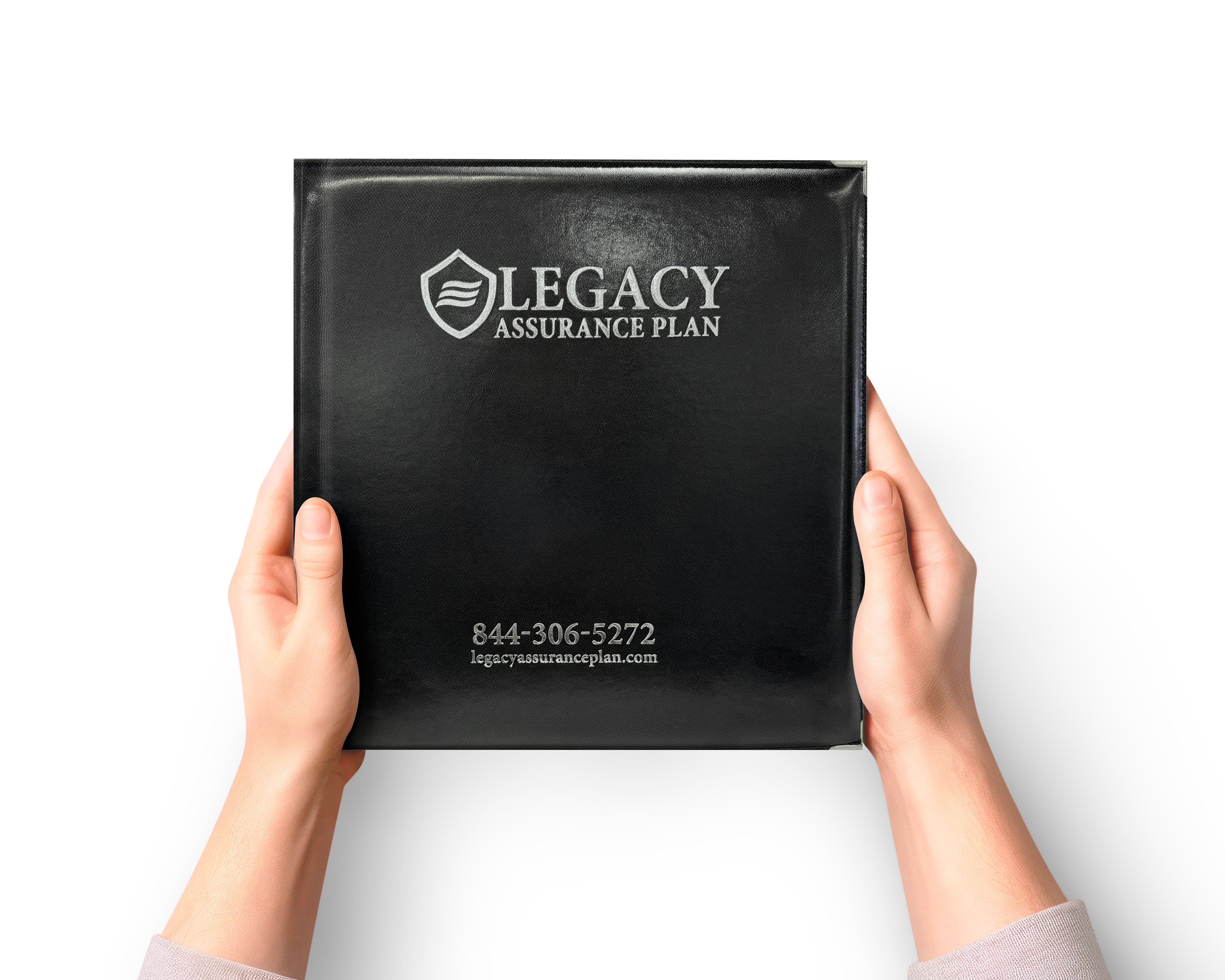 Hands holding a black binder with the logo and text 'Legacy Assurance Plan' and contact information including phone number 844-306-5272 and website legacyassuranceplan.com.