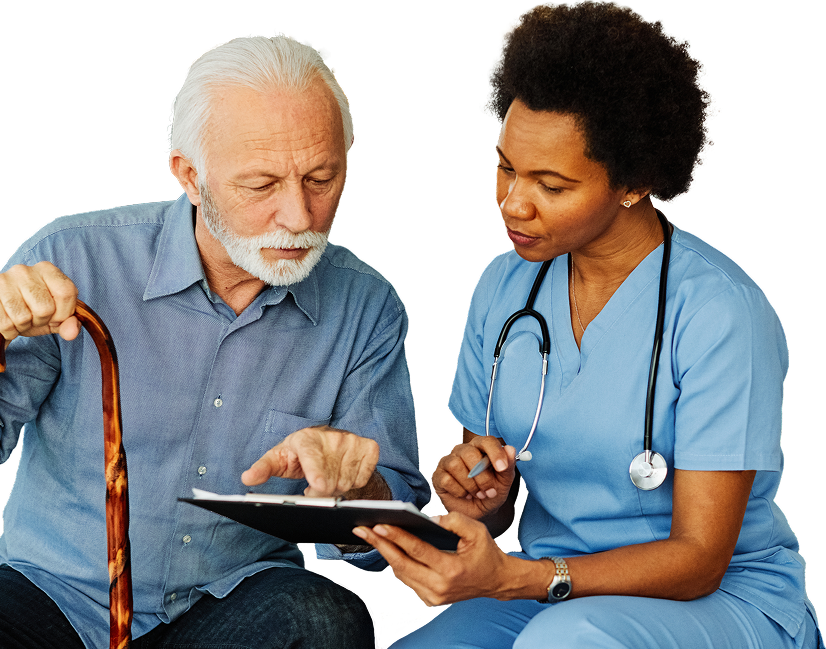 nurse helping elderly man fill out document